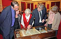 Inspecting the Beeston Bible at the Luncheon with verse 36 being pointed out by Professor John Becket. L to R: Bishop Paul Butler, Barbara Cast, Rosalys Coope, John Beckett and Dorothy Johnston	(Photo: Howard Fisher).