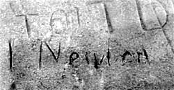 Newton's name scrathched in stone
