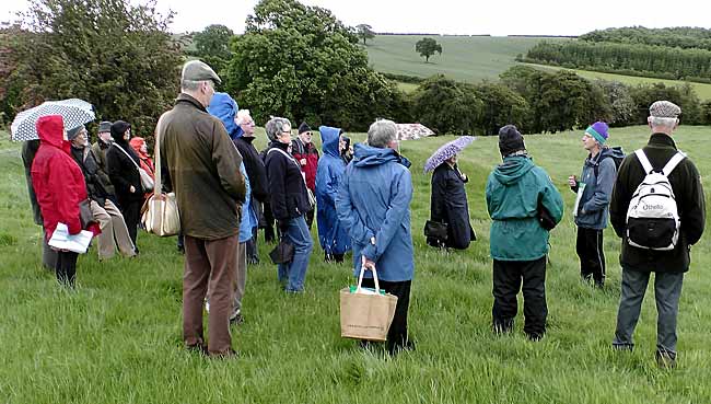 Dr. David Knight explaining features of Oxton Hill Fort to the outing group on 9 June 2012 (Photo: Howard Fisher).