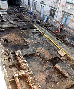 Nottingham Castle excavations in progress, showing drains and surfaces associated with the Ducal Palace courtyard.